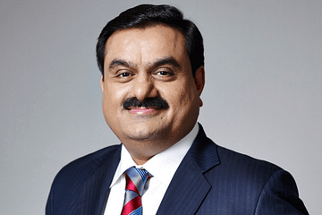 gautam adani in blue court with smile and Interesting facts about gautam adani